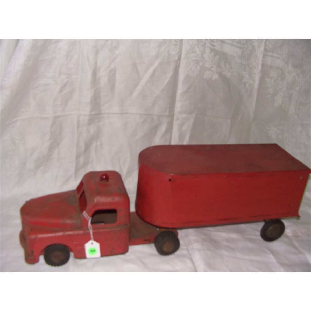 metal red toy truck and trailer