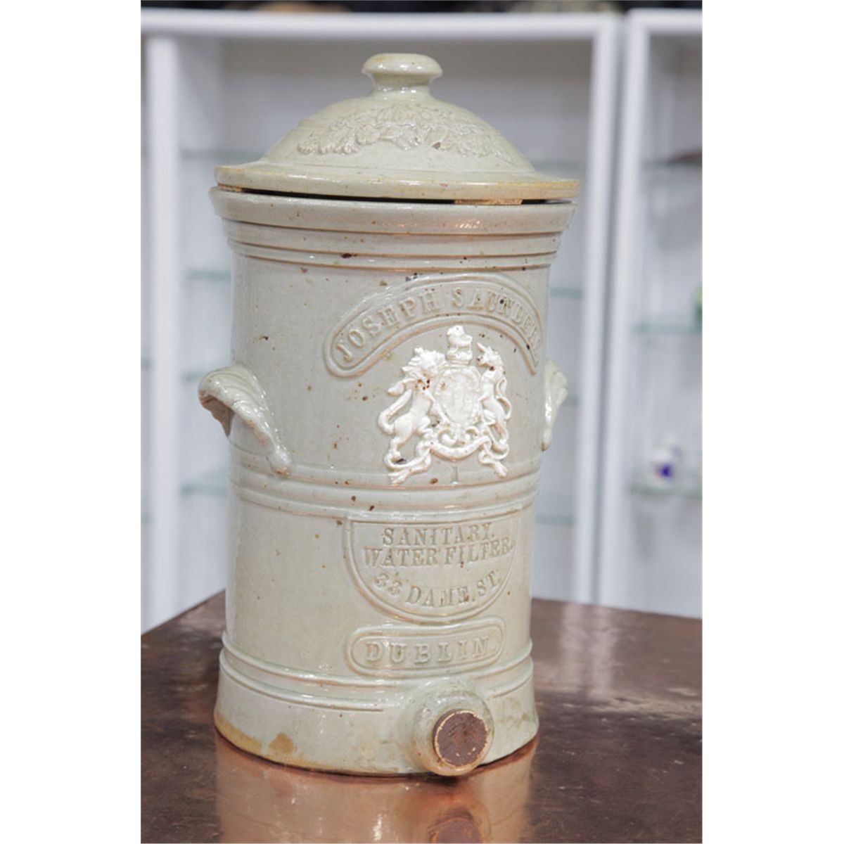 STONEWARE LIDDED WATER COOLER WITH FILTER. Manchester, England, by