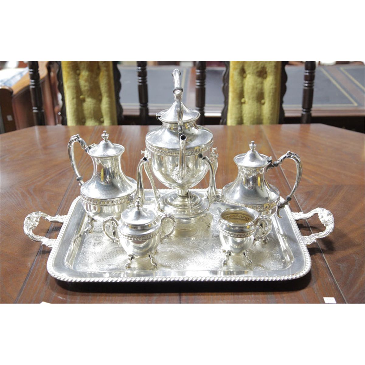SIX PIECE SILVER PLATED TEA SET. Silver on copper and including water