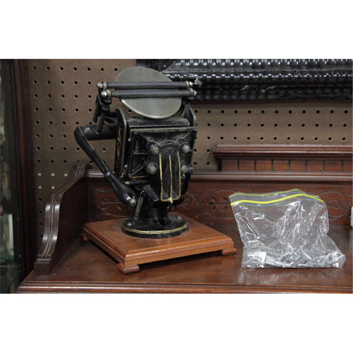 MINIATURE PRINTING PRESS WITH TYPE. Black painted cast iron table top