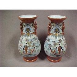 A pair of Japanese Kutani vases, urn shaped