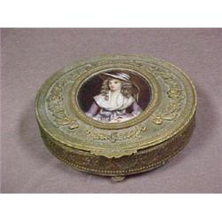 Oval bronze dresser jar with round porcelai