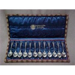 A set of twelve demitasse sterling silver s