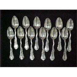 A set of twelve sterling silver dessert spo