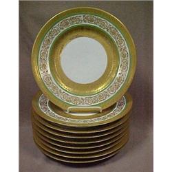 A set of nine gilt enameled service plates