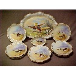 Eleven piece hand painted game set marked