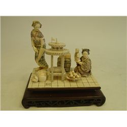 Japanese ivory grouping depicting "Family Scene"