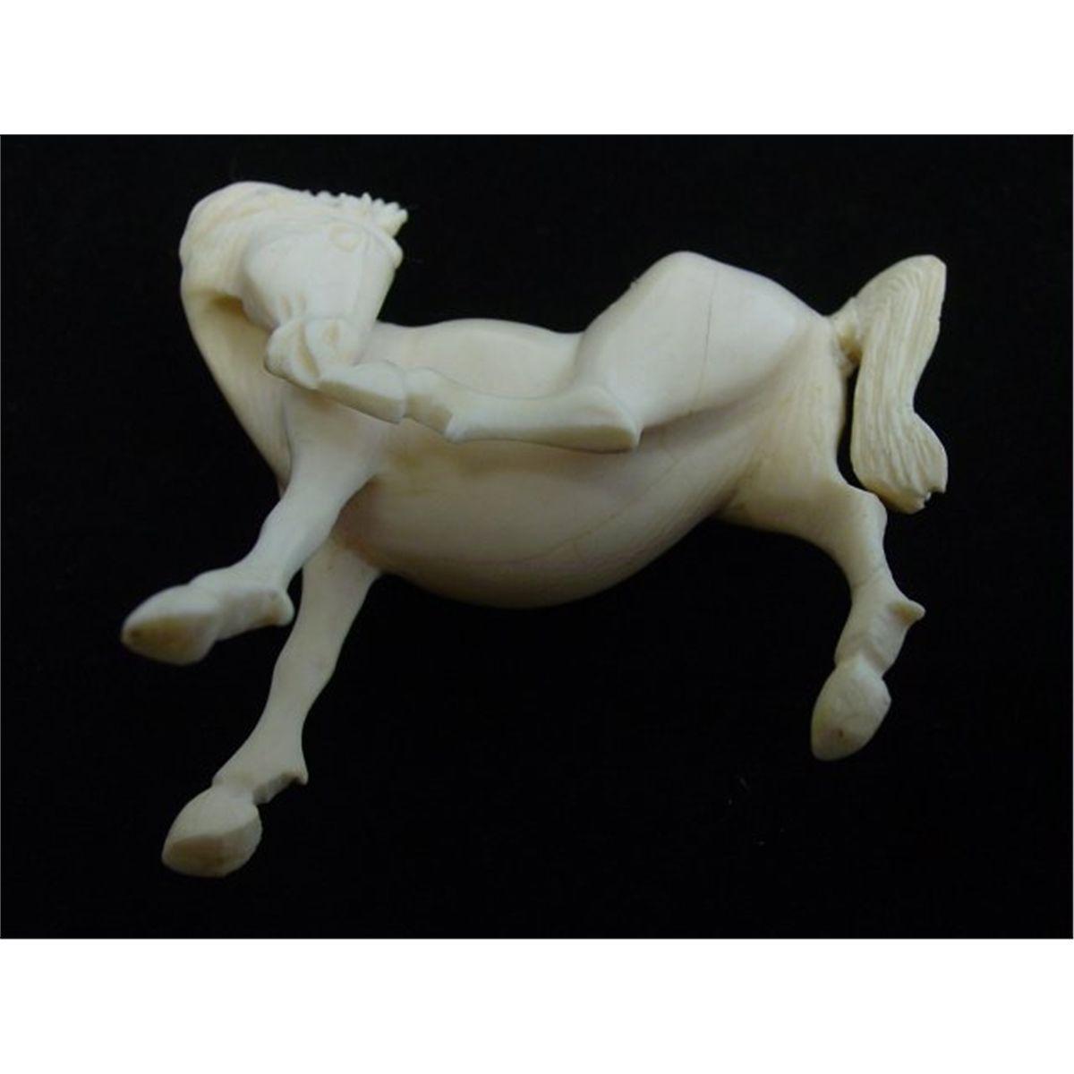 2 ivory figurines of a "Horse" & "Elephant"