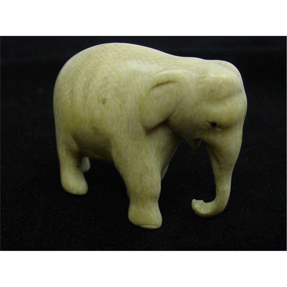 2 ivory figurines of a "Horse" & "Elephant"