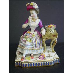 German porcelain figure "Seated Girl"