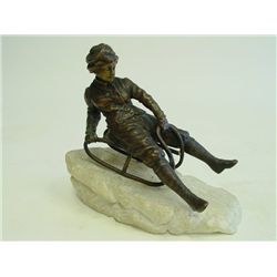 Bronze figure of "Boy on Sleigh" signed Kirchner