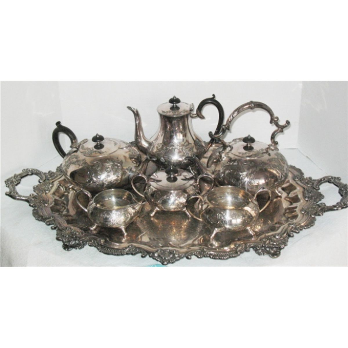 7 piece Sheffield silver plate on copper tea set