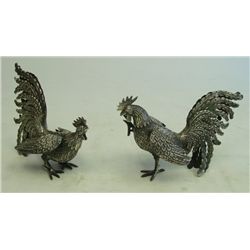 2 silver roosters