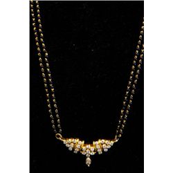 Yellow gold black onyx beads & diamond necklace