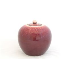 Large red glazed jar with lid
