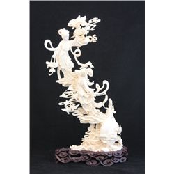 Heavily carved Chinese ivory on rosewood base