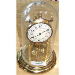 Kundo glass encased mantle clock
