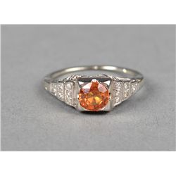 A 18kt White Gold & Padparadscha Sapphire Ring