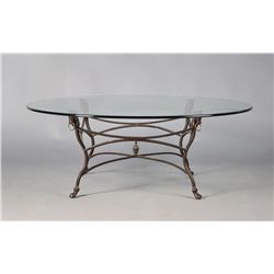 An Iron and Beveled Glass Coffee Table