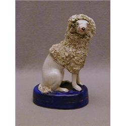 A STAFFORDSHIRE SEATED POODLE