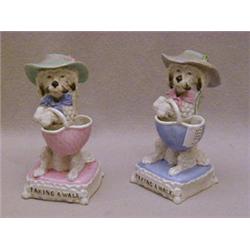 A PAIR OF FAIRING DOG FIGURES