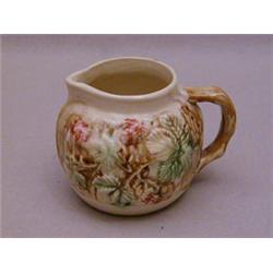 A SMALL 19TH CENTURY MAJOLICA JUG