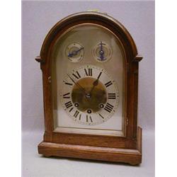 AN EDWARDIAN OAK BRACKET CLOCK