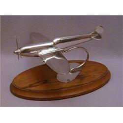 A SILVER TABLE-TOP MODEL OF A SPITFIRE