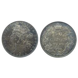 1892 50¢ ICG AU58.  Intense shades of blue and brown with underlying lustre.