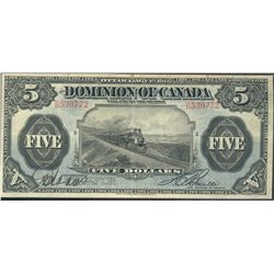 1912 $5 DC-21c #B530772. Nice train example in abt VF grade with 3 minor tears in upper border.