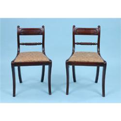 SIX REGENCY SABRE LEG CHAIRS, the channel moulded bar backs with a rope twist lumber rail, the drop-