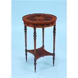 AN EDWARDIAN MAHOGANY INLAID OCCASIONAL TABLE IN THE SHERATON STYLE, the circular top profusely inla