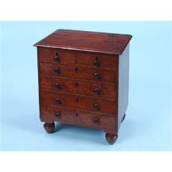 A GOOD VICTORIAN MINIATURE MAHOGANY CHEST, the rectangular moulded top above two short and four long