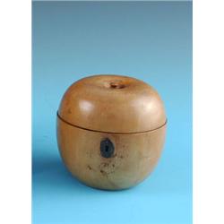 A LATE GEORGE III PEARWOOD TEA CADDY, circa 1800, of apple form, the hinged cover surmounted by a tu