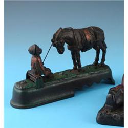 ALWAYS DID' SPISE A MULE': AN AMERICAN CAST IRON MONEY BANK, late nineteenth century, in the form o