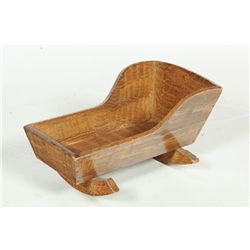 DECORATED DOLL CRADLE.