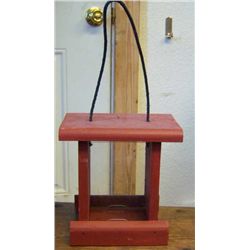 1 Dark Red Bird Feeder and Green Metal Feeder .