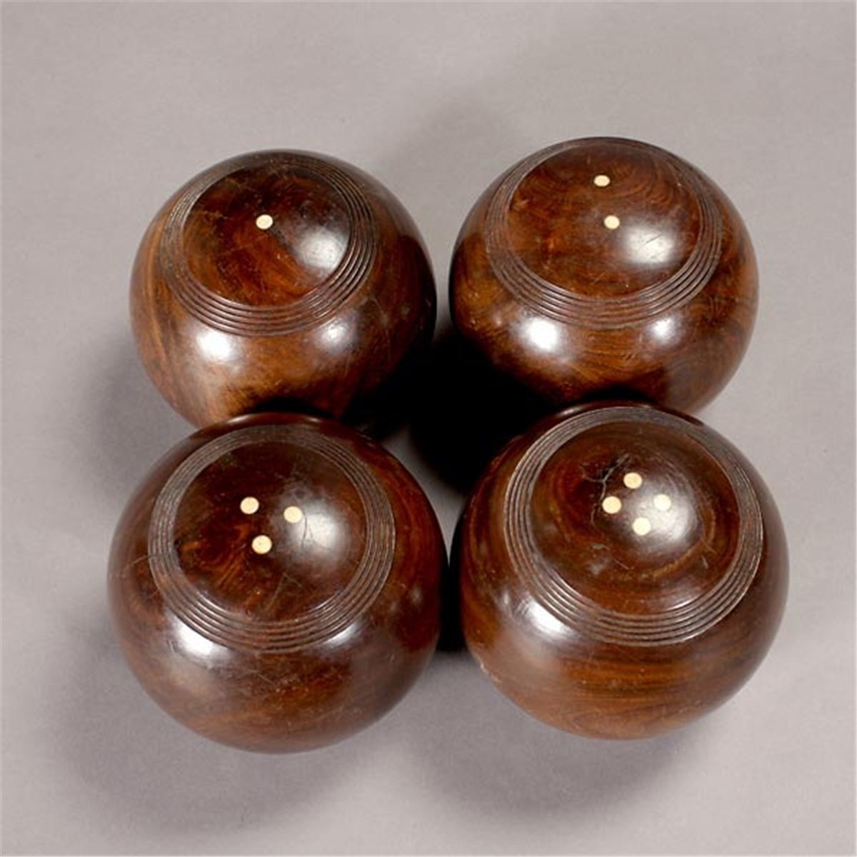 Cased Set of Eight Lignum Vitae Lawn Bowling Balls