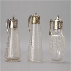 Three Aesthetic Movement Plated Claret Jugs