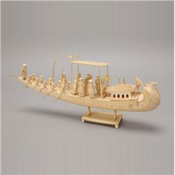 A Carved Ivory Boat and Figures*