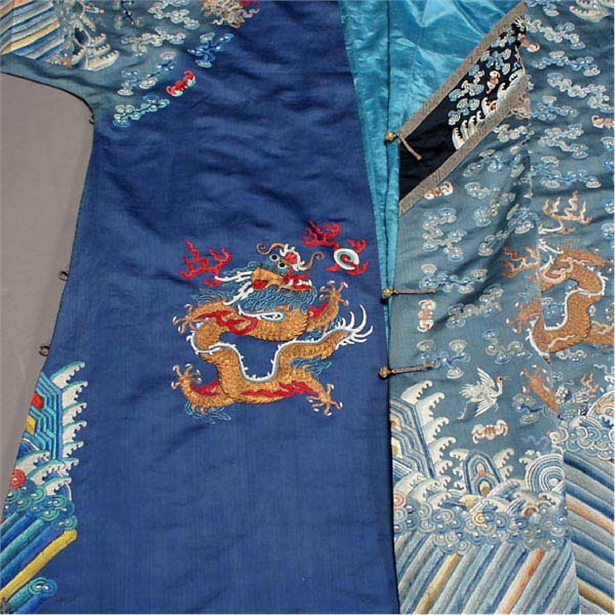 An Embroidered Blue Ground Dragon Robe, Qing