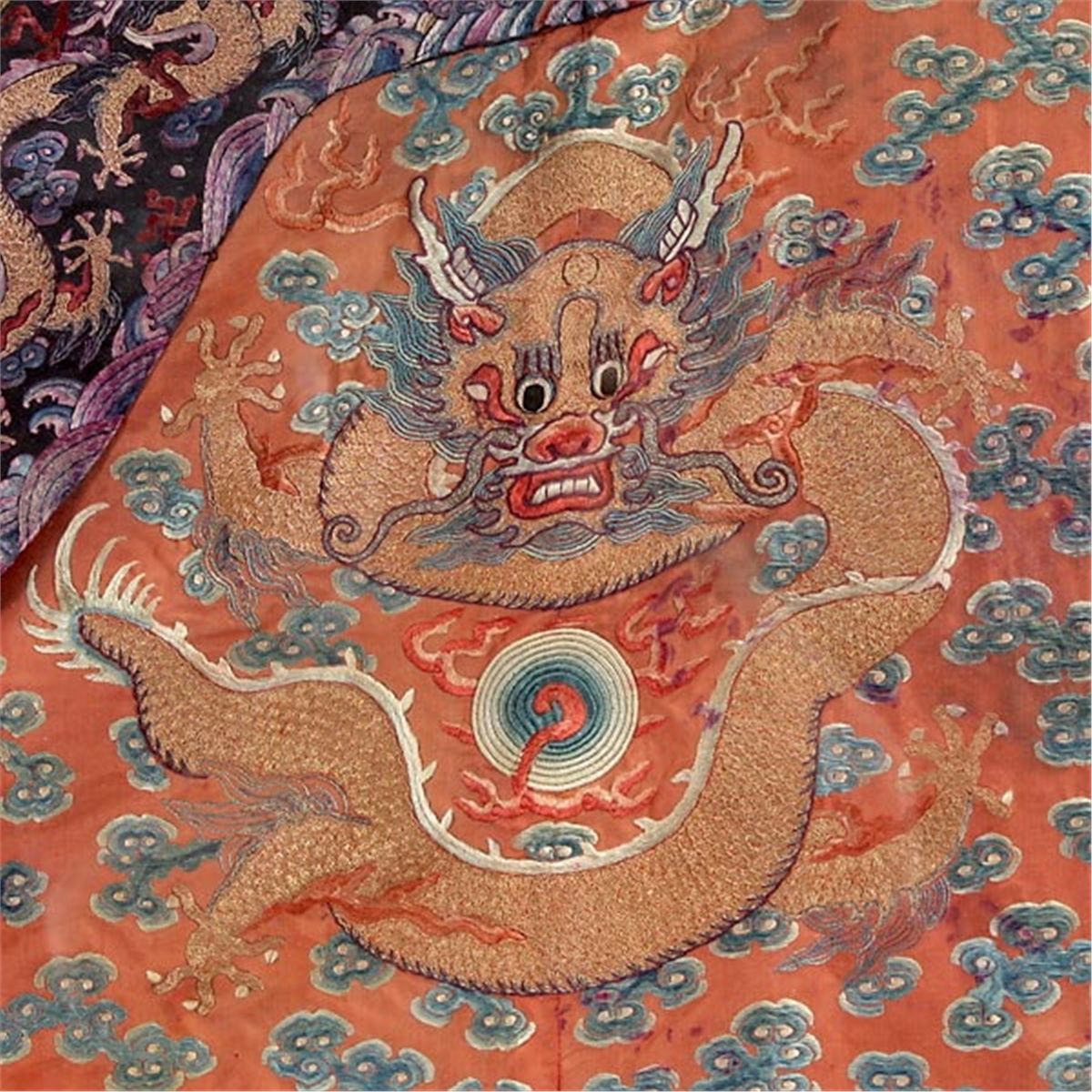 An Embroidered Red Ground Dragon Robe, Early 19th C