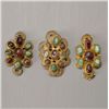 Image 1 : A Group of Three Precious Stone and Metal Ornaments