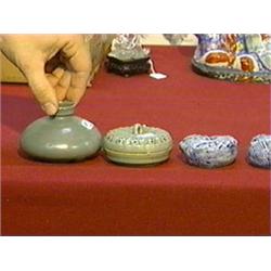 Group of four Korean ceramics: inlaid celadon box, celadon oil bottle (chips to both) and two blue a