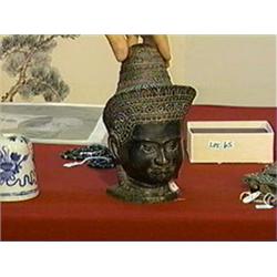 Khmer-style bronze head of a deity, Phnom Penh style, stand
