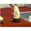 Image 1 : Scrimmed whale's tooth with lady liberty design, wood stand