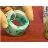 Image 1 : Large Chinese, carved jadeite "archer's ring"-form object with some apple-green coloration (probably