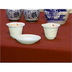 Three pieces of antique, Chinese white Peking glass: pair of carved foliate bowls with lotus and a s
