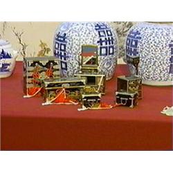 Old and well-detailed, Japanese miniature set of seven pieces of lacquered doll's furniture: tansu, 