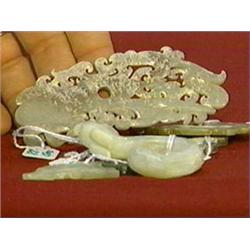 Group of five, well-carved Chinese, archaistic "calcified" jade or hardstone plaques with various de